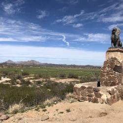 Landscape of lion statue and mountains near San Xavier