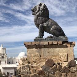 Lion statue outside San Xavier Mission