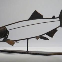 A metal sculpture of a trout by Don Rambadt